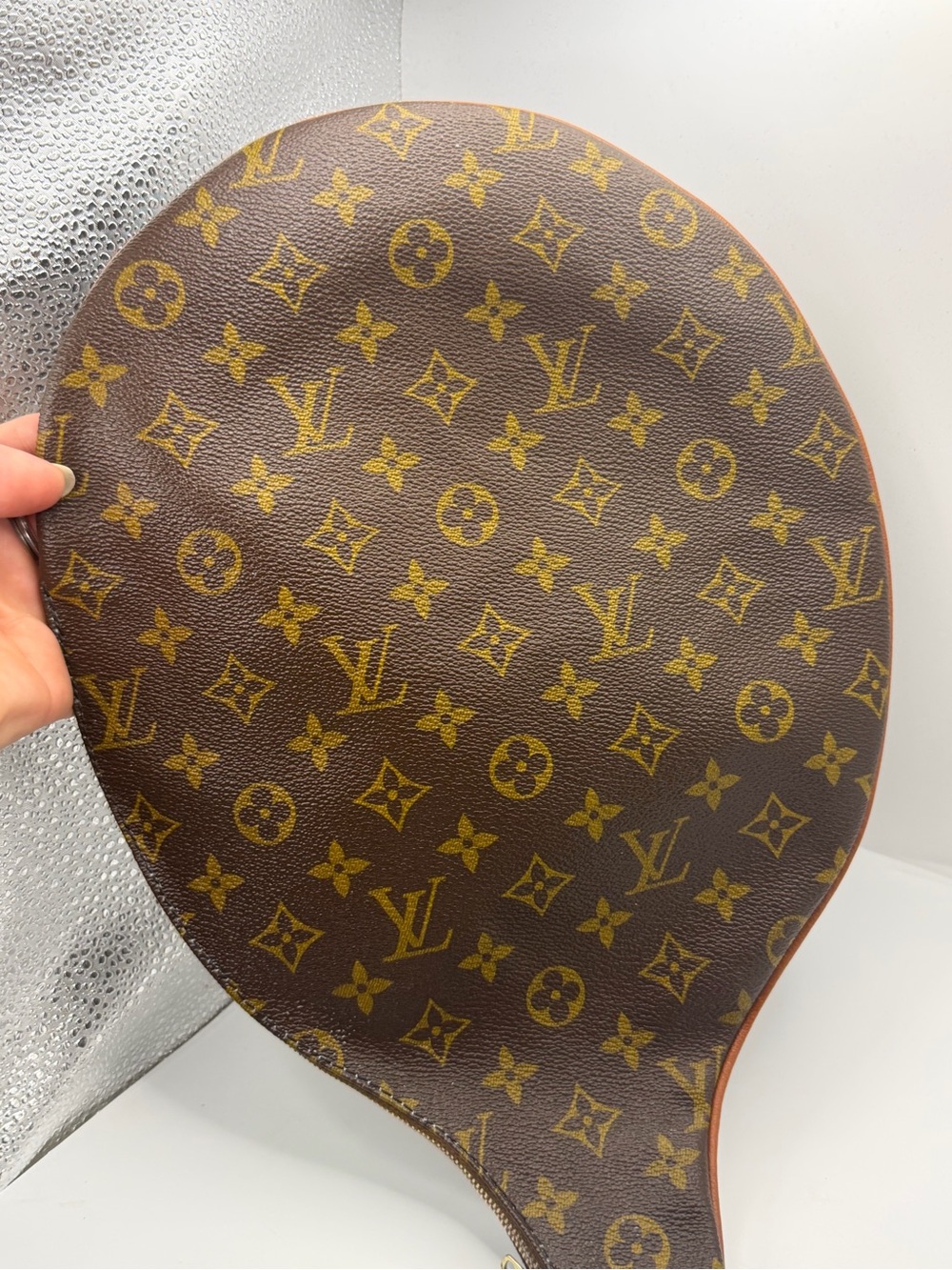 Louis Vuitton Monogram Tennis Racket Cover (often called an Etui
Racquet).